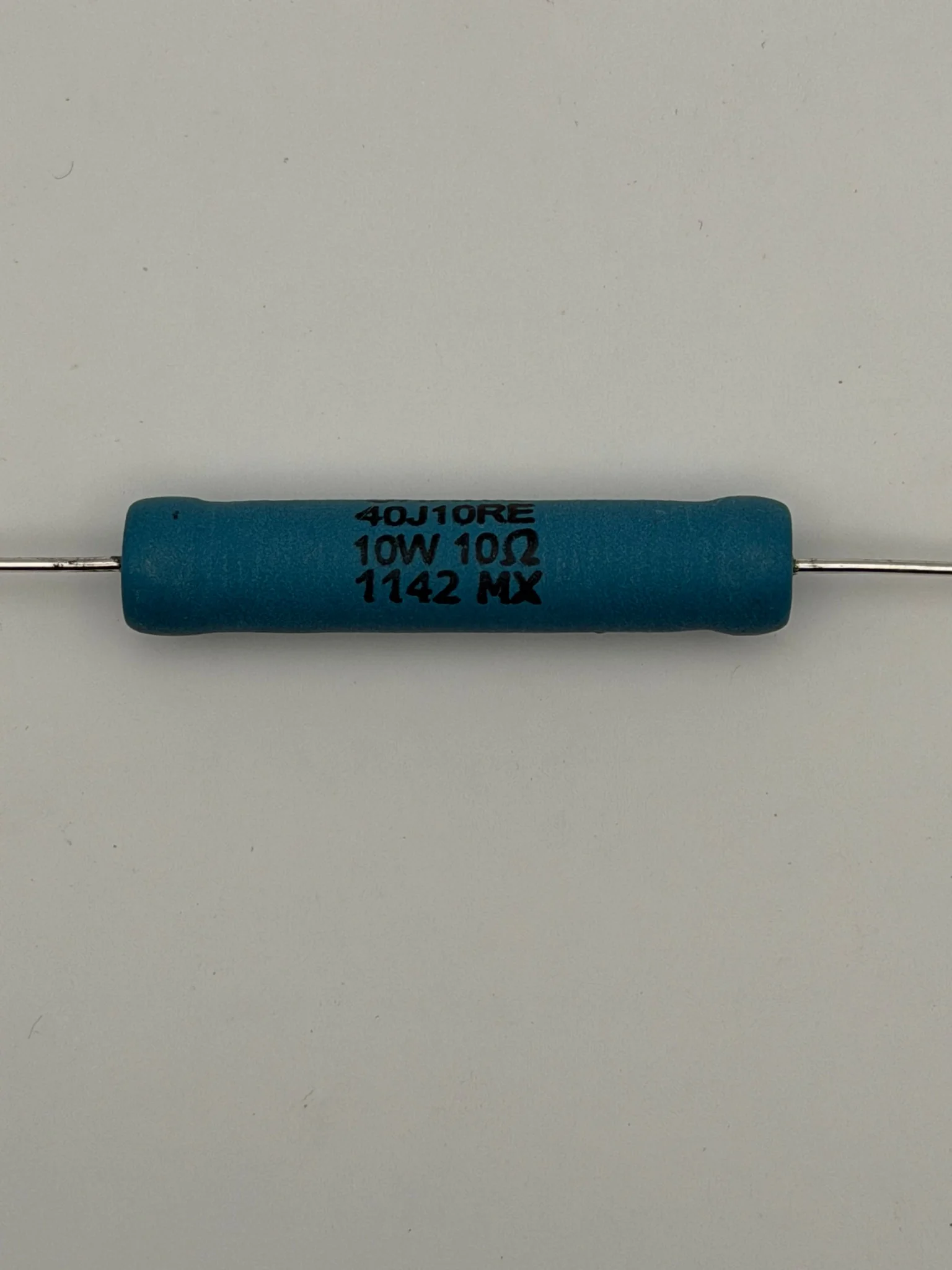 Close view of an Ohmite 40J10RE resistor showing the 10 watt, 10 ohm, and 1142 MX markings