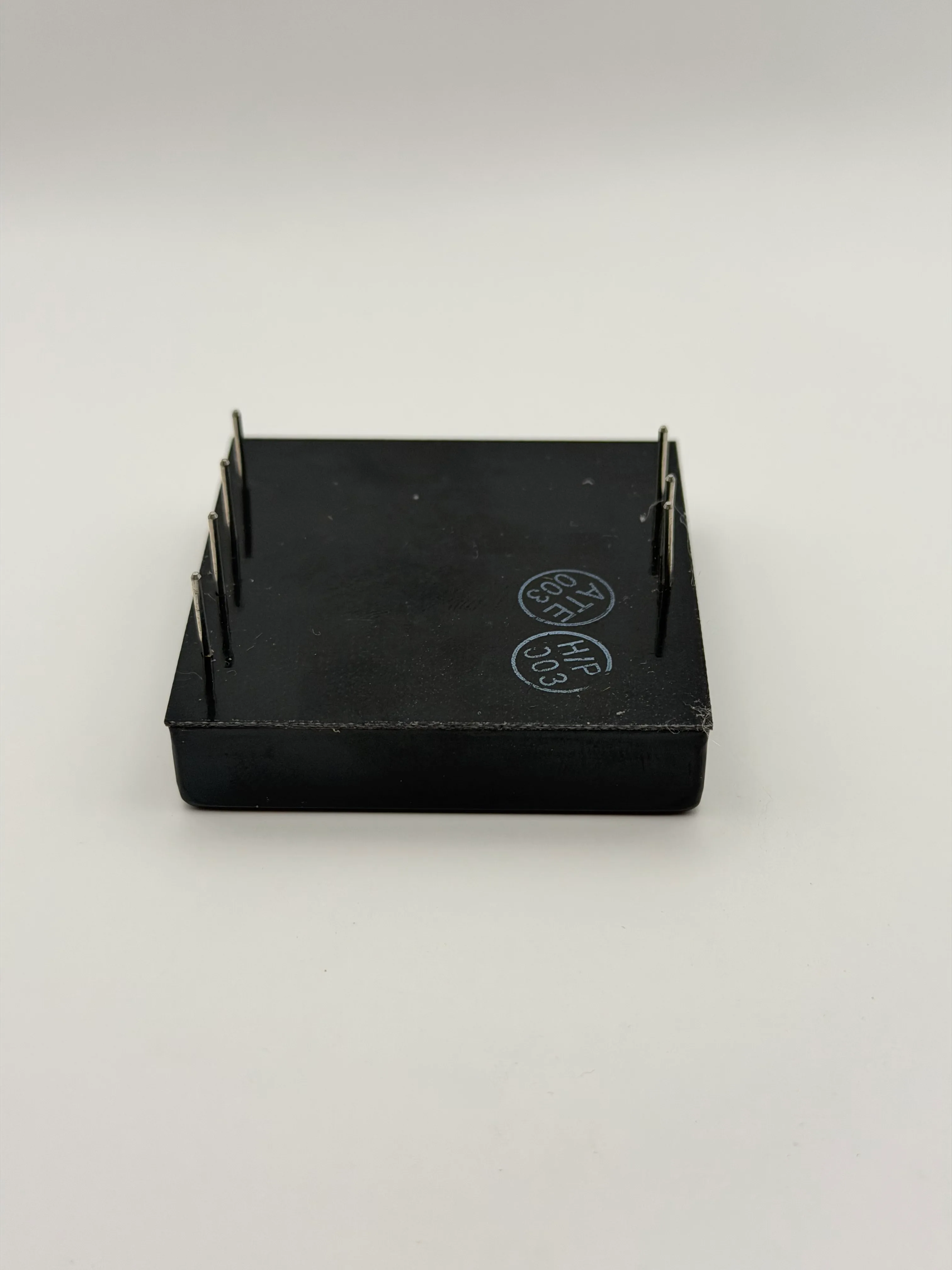 Underside of the DGP20E24T5/15 module showing the unsoldered through-hole pins
