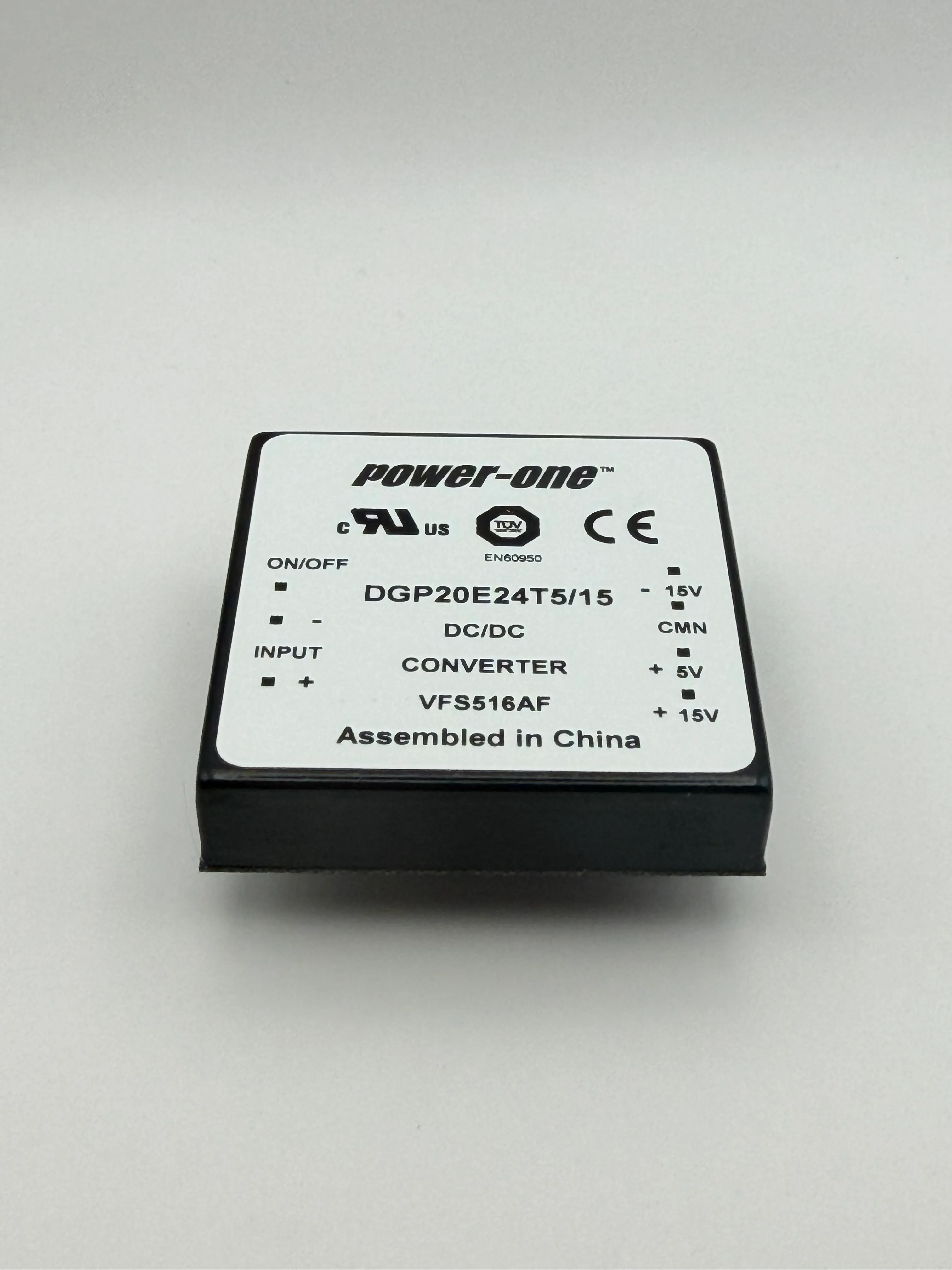 Angled view of the Power-One DGP20E24T5/15 converter label