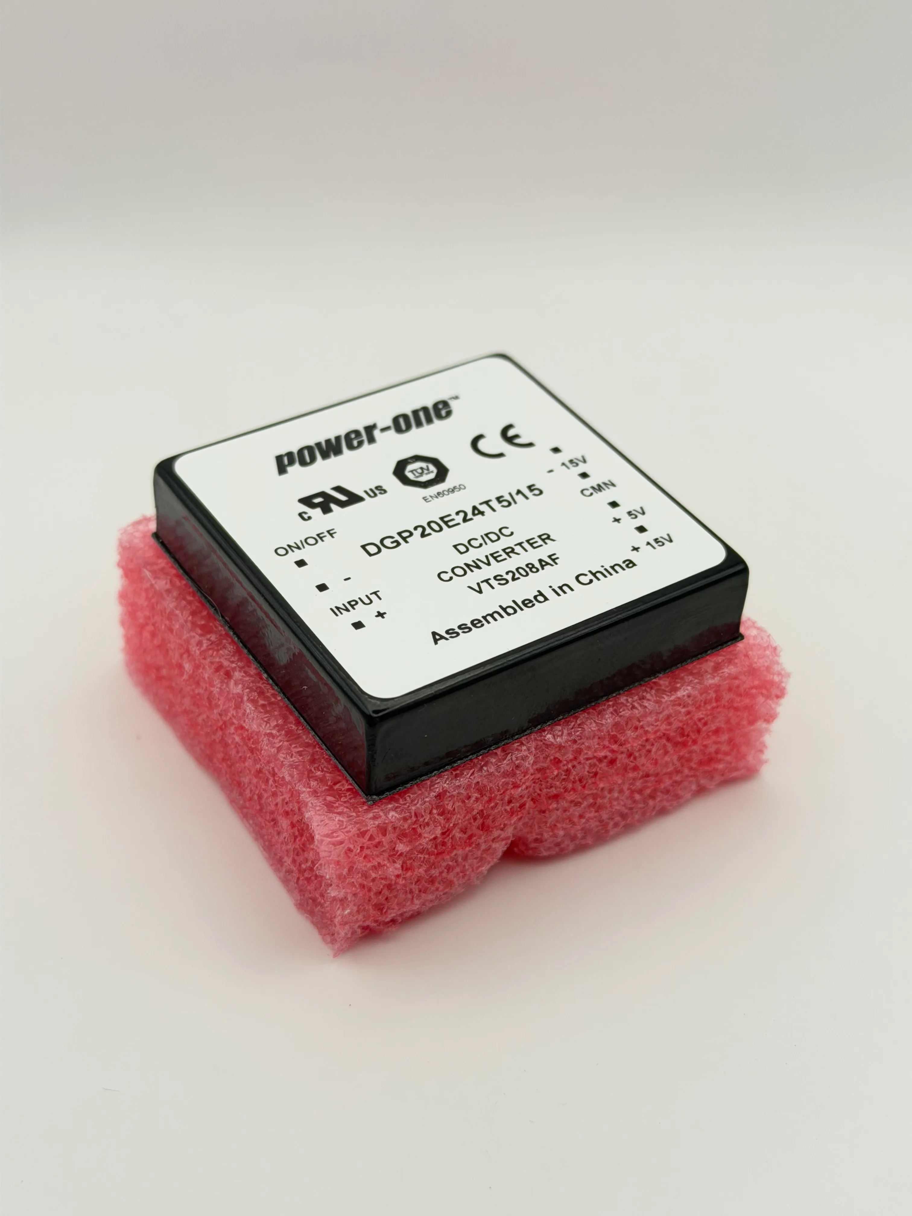 Power-One DGP20E24T5/15 converter resting on protective pink foam