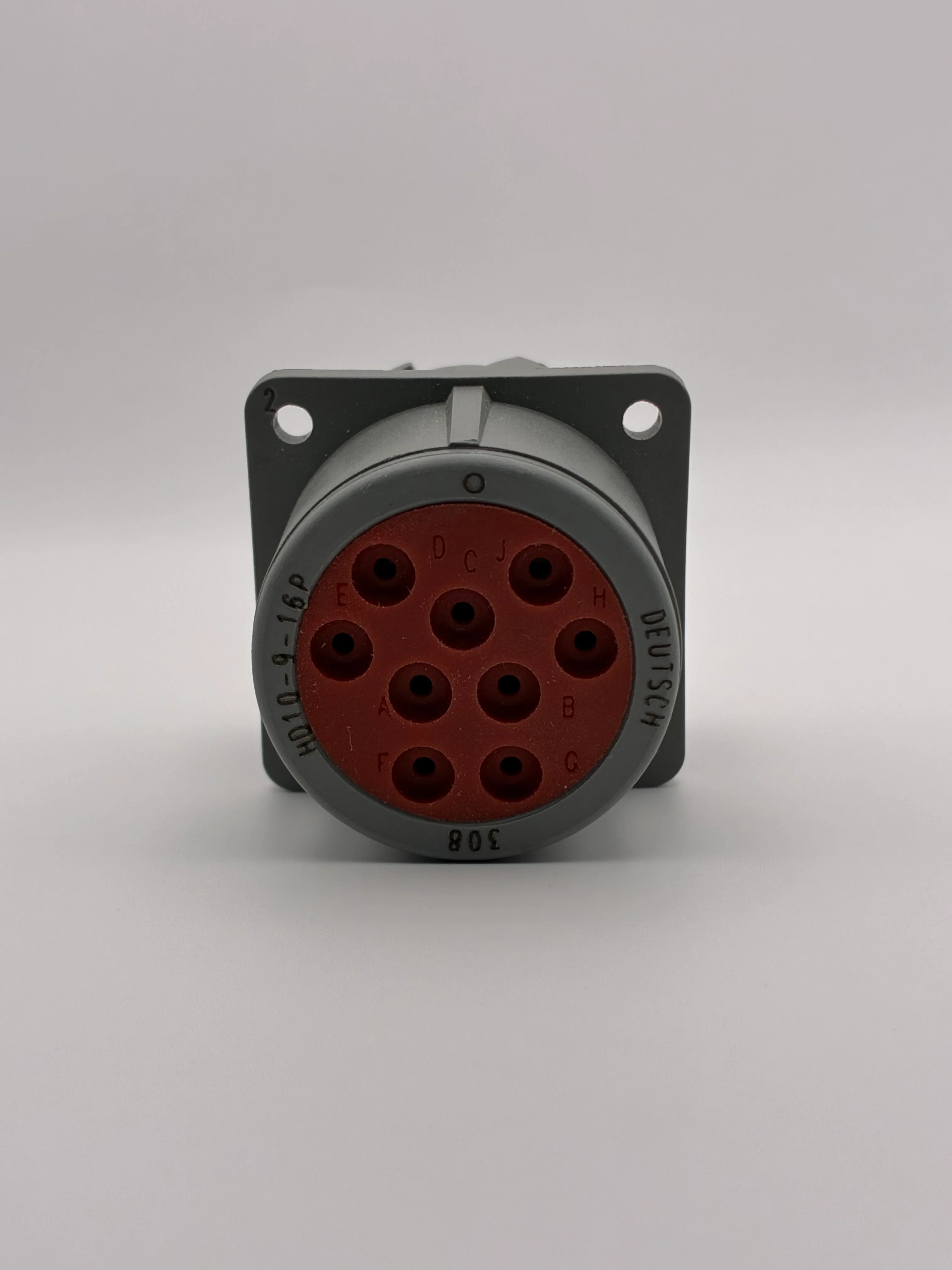 Front face of a gray Deutsch HD10-9-16P receptacle showing the 9-cavity insert and part marking